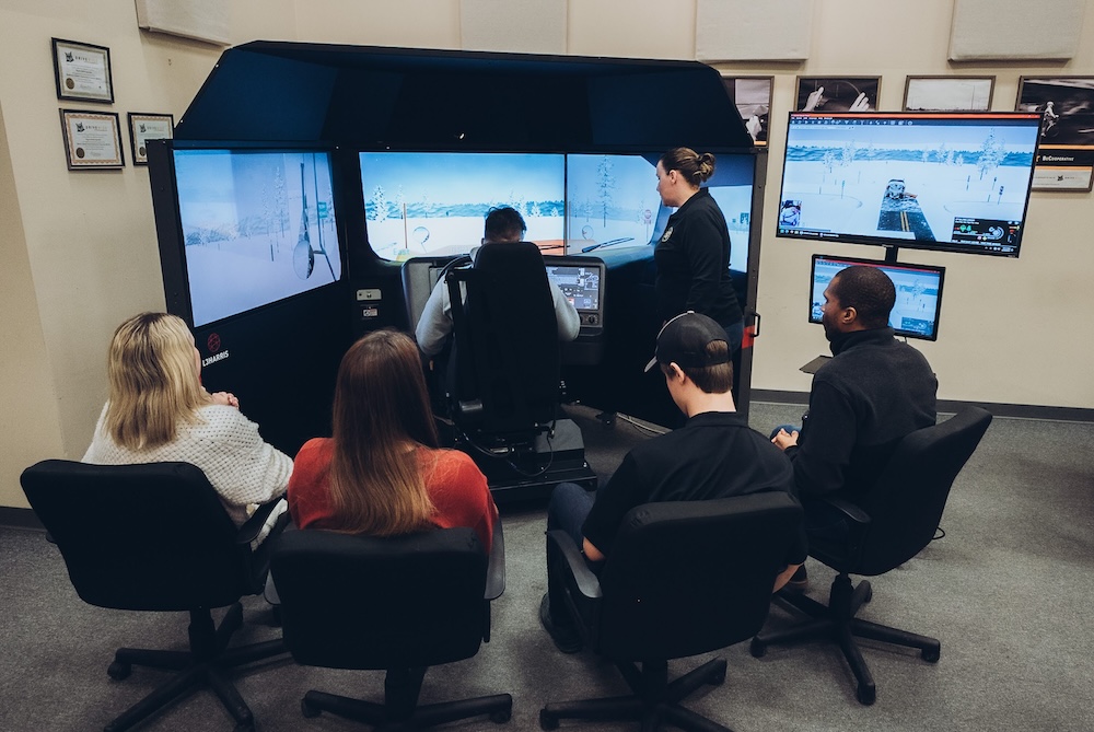 Teacher-showing-snowplow-simulator